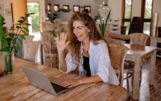 An employee participating to a meeting while doing remote work.