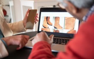 Two people browsing an online store, keeping up with the latest e-commerce trends.